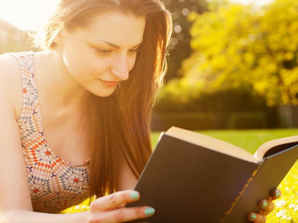 Girl Reading Book in Garden