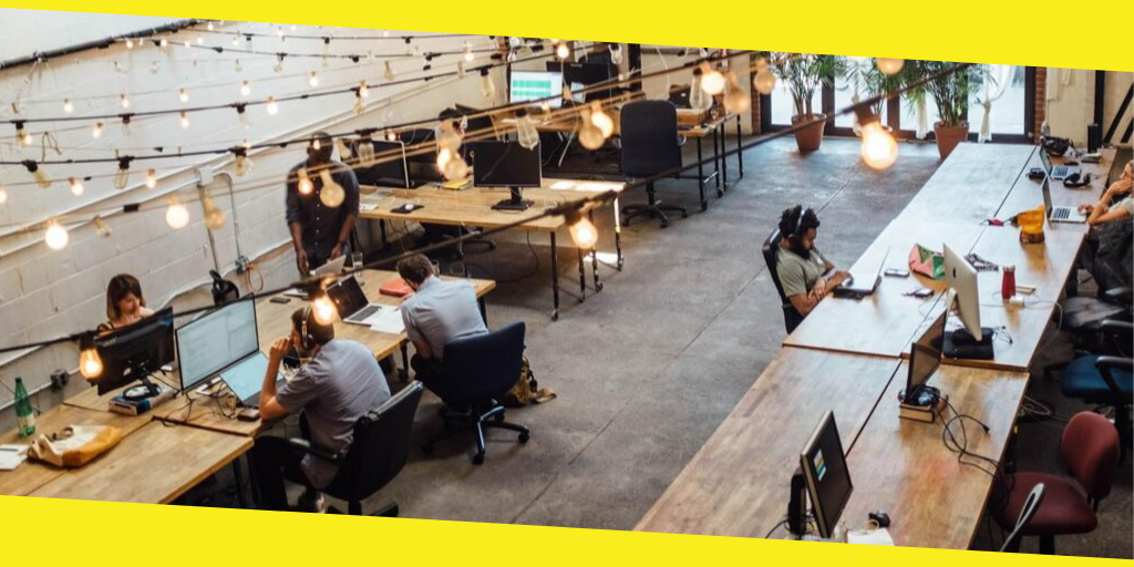 Business professionals collaborating in a modern coworking space, enhancing productivity and innovation