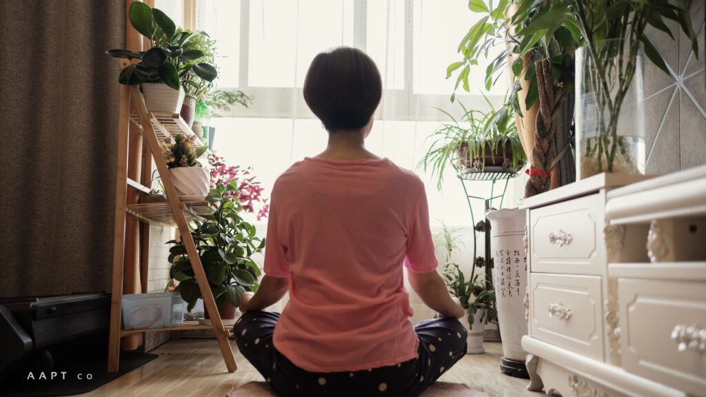 mother meditating at home