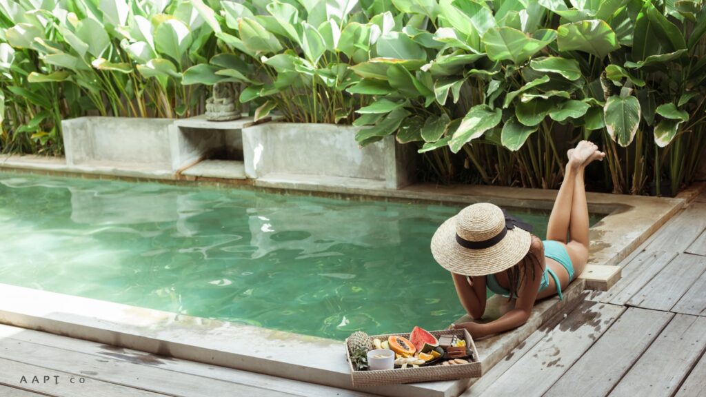 Girl at luxury swimming pool