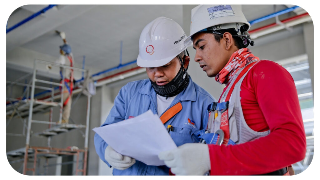 Two Man Holding White Paper