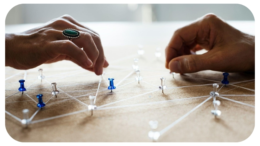 Hands holding connecting pin network.