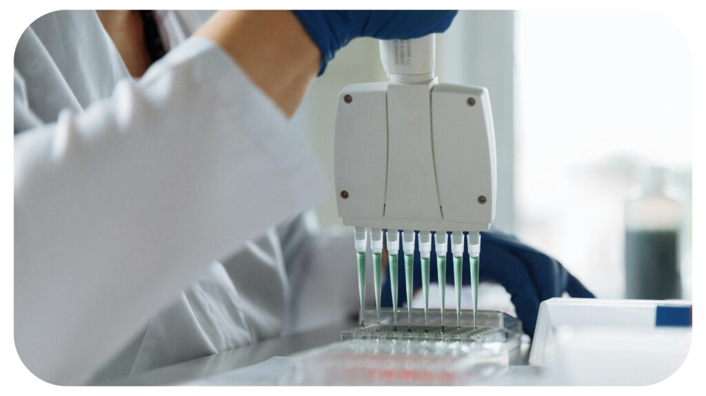 Scientist Holding a Pipette.