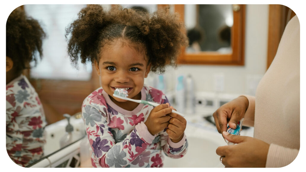 Curly Haired Girl Brushing Teeth