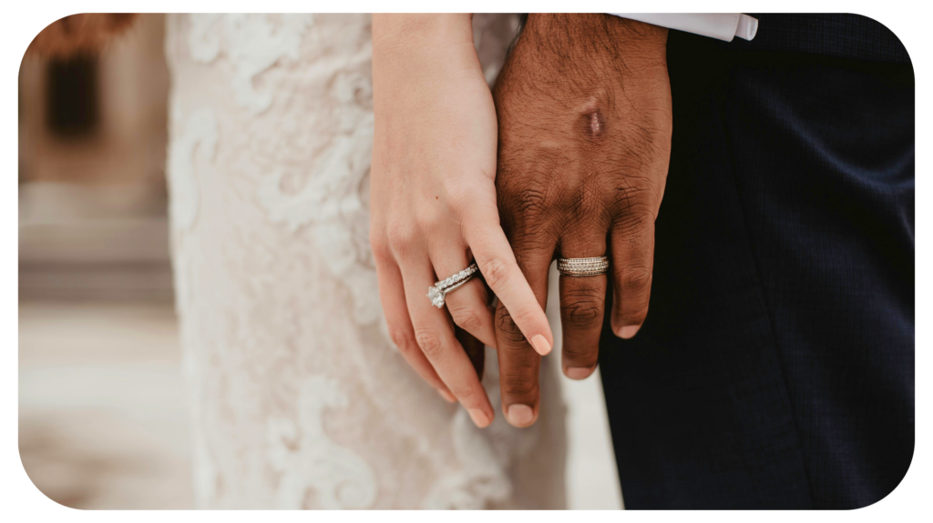 Two Persons Wearing Silver-colored Rings