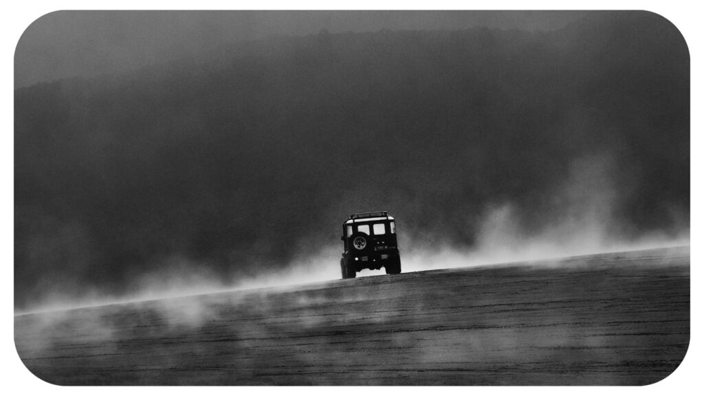 Whispers in the Fog Jeep Roaming the Enigmatic Dunes. Black and White Photo. Abstract photography. Vehicle photography.