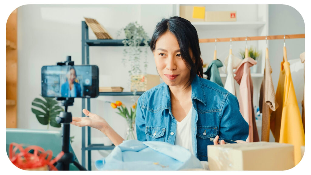 influencer creating authentic marketing content while recording a product review video for social media audience engagement.