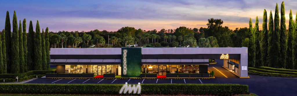 Exterior view of Magic Moment Resort and Kids Club in Orlando showing the boutique family friendly hotel entrance designed to welcome parents and children with a warm resort experience.