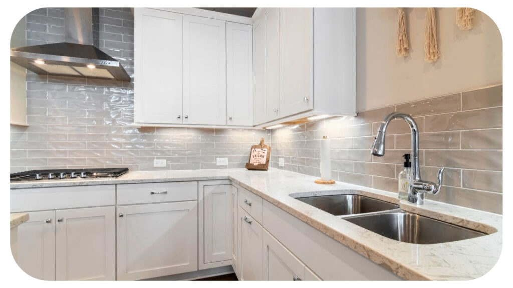 Modern remodeled kitchen with upgraded cabinets countertops lighting and sink representing common signs your kitchen needs remodeling for better functionality storage and style.