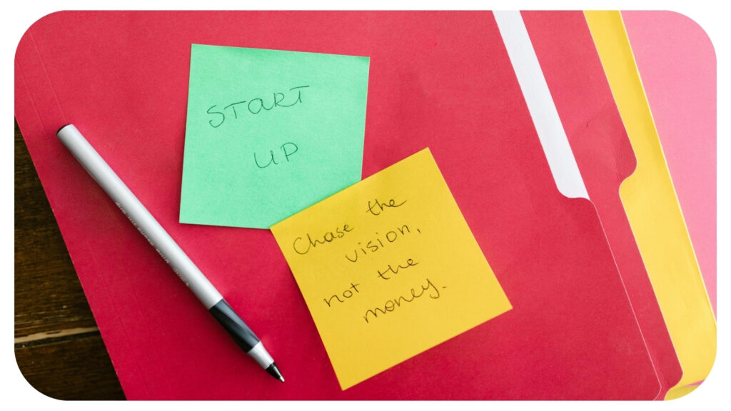 Startup planning notes and business documents on a desk representing startup growth strategy business planning scalable operations and long term business success after product launch.