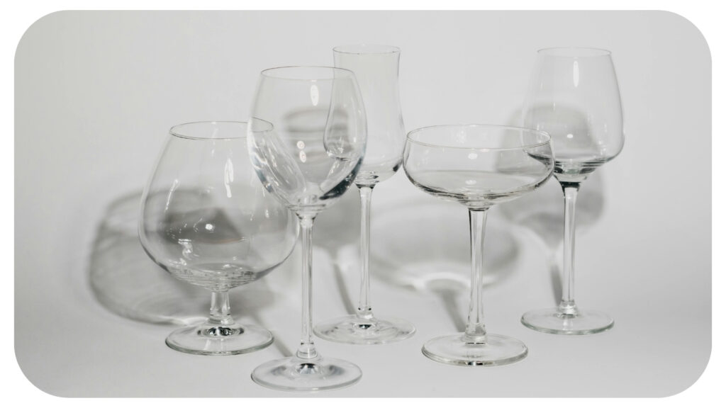 Crystal clear glassware and decorative glass equipment displayed after cleaning showcasing spotless streak free surfaces maintained with effective glass cleaning tools and techniques.