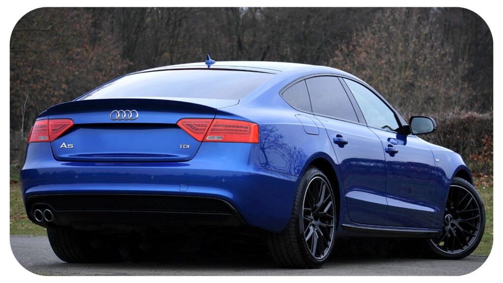 Blue sedan with professionally tinted windows parked outdoors, showcasing the benefits of vehicle window tinting for improved UV protection, reduced interior heat, enhanced privacy, glare reduction, and long term interior protection in Pembroke Pines, Florida.