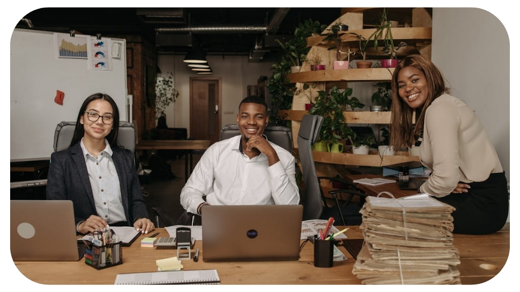 Diverse business leaders and professionals collaborating in a modern office, demonstrating the importance of leadership in corporate America through teamwork, employee engagement, organizational culture, strategic decision making, and business success.