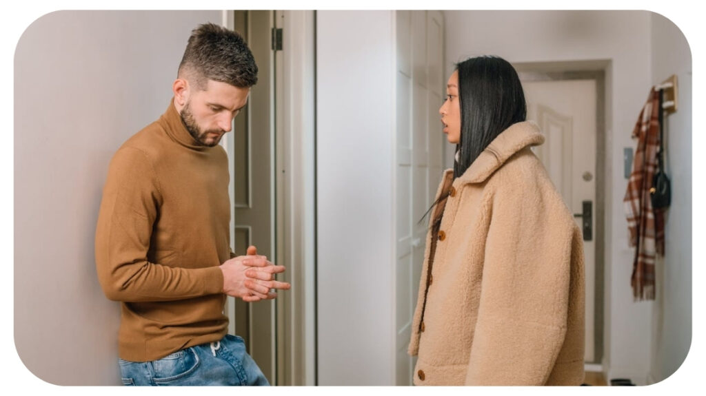 Couple having a serious conversation at home illustrating relationship conflict communication challenges emotional distance and the importance of healthy conflict resolution in relationships.