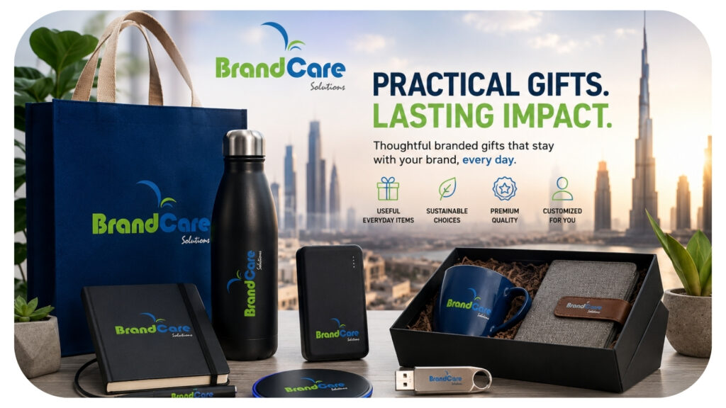 Branded corporate gift set with tote bag, water bottle, power bank, notebook, and mug arranged with Dubai skyline.