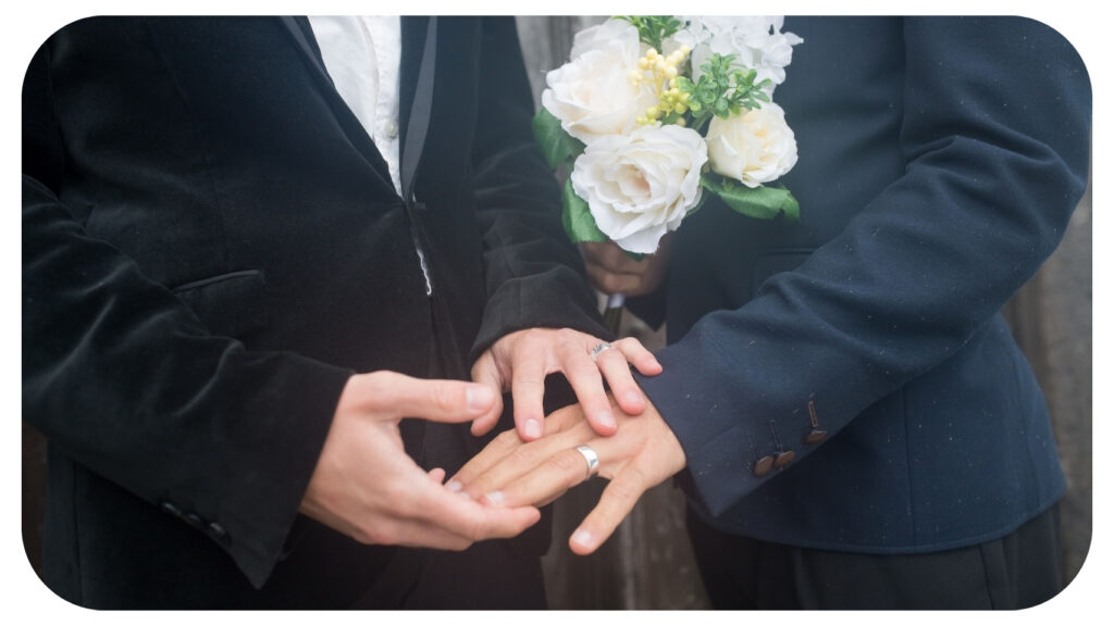 A couple exchanging wedding rings during an inclusive wedding ceremony, representing inclusive wedding vendors who support LGBTQ+ couples, multicultural celebrations, accessible wedding planning, and personalized wedding experiences that reflect every couple’s unique vision and values.
